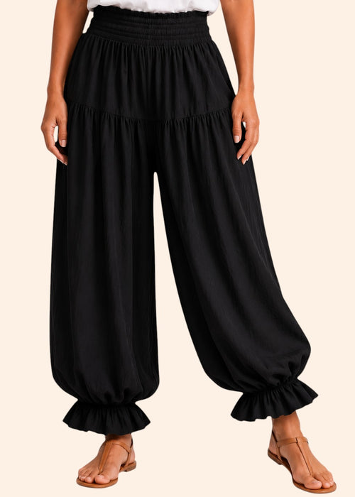 Zeemara black balloon pants featuring a comfortable shirred waistband, side pockets, and ruffled cuffs.