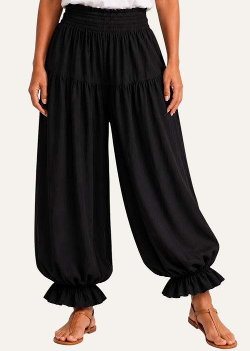 Zeemara black balloon pants featuring a comfortable shirred waistband, side pockets, and ruffled cuffs.