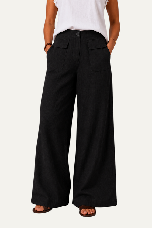 Zeemara black high-waisted wide-leg pants featuring a button front and functional patch pockets on a model