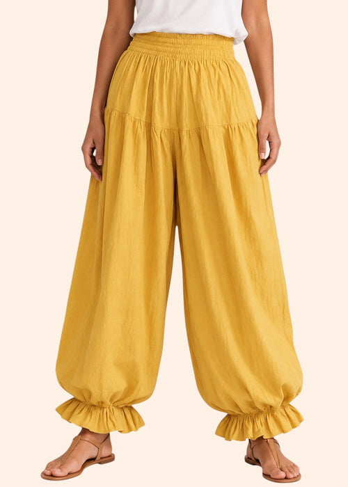 Zeemara mustard balloon pants featuring a shirred elastic waistband, side pockets, and ruffled hem detail.