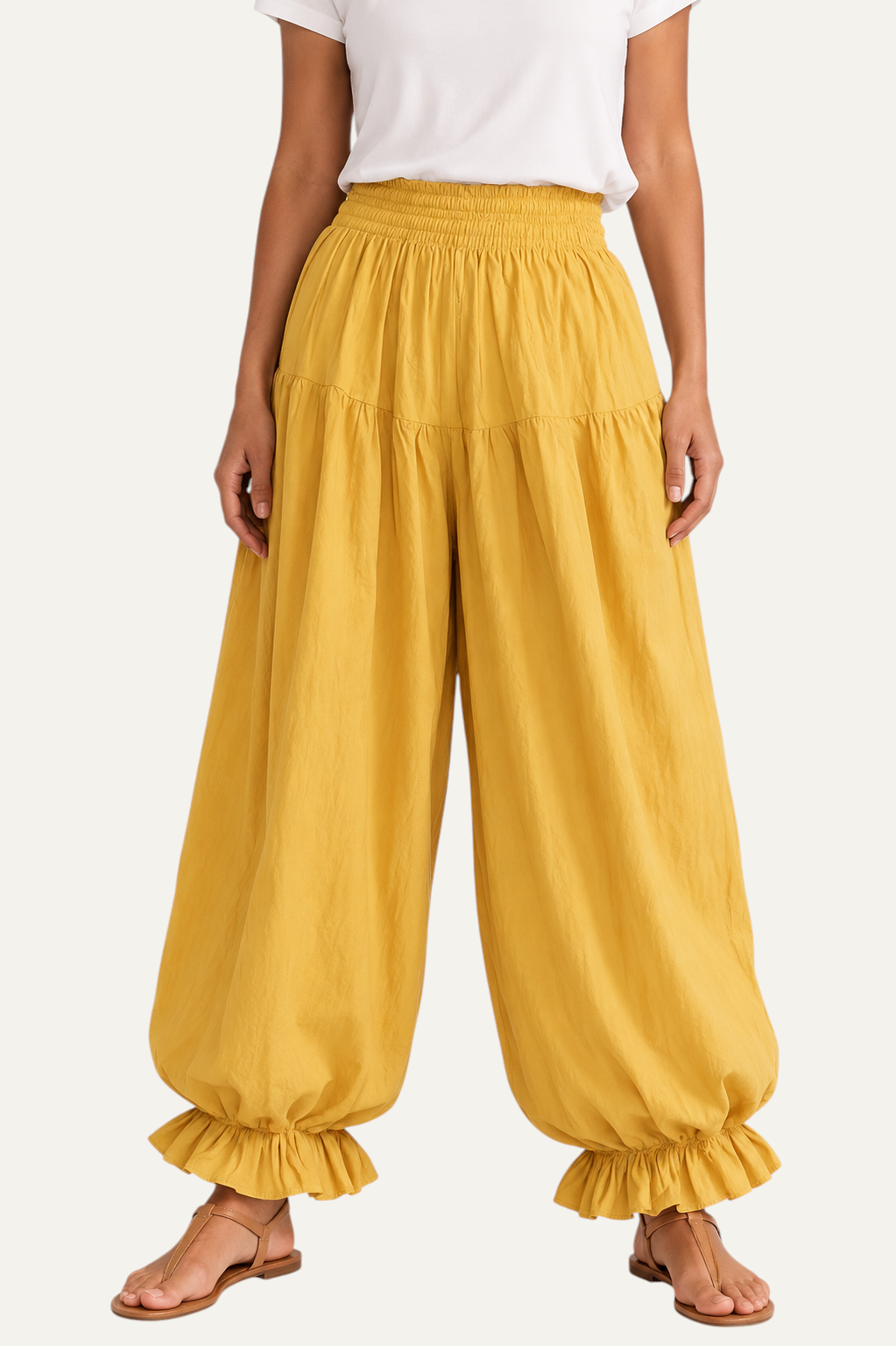 Zeemara mustard balloon pants featuring a shirred elastic waistband, side pockets, and ruffled hem detail.